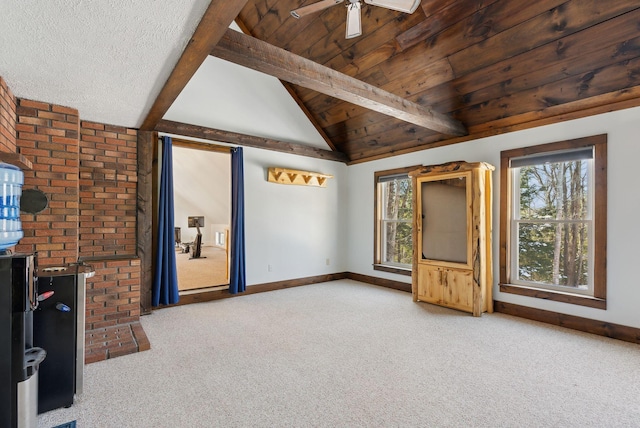 unfurnished living room featuring baseboards, carpet flooring, and ceiling fan