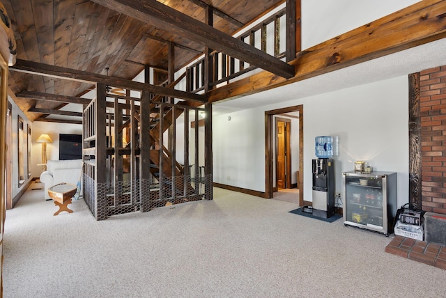 stairs with wood ceiling, beamed ceiling, baseboards, carpet flooring, and wine cooler