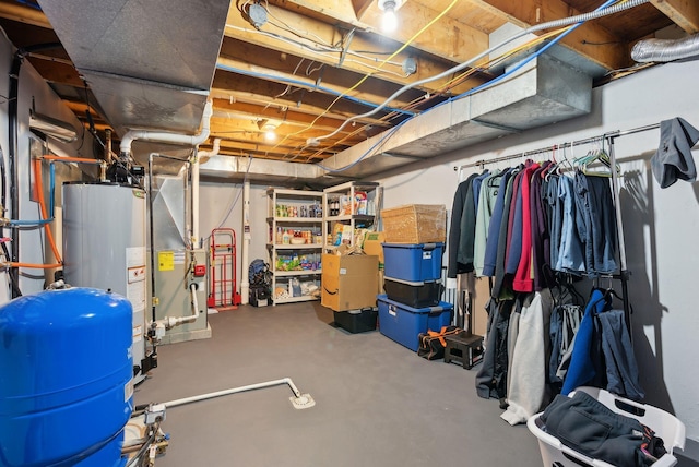 unfinished below grade area featuring water heater