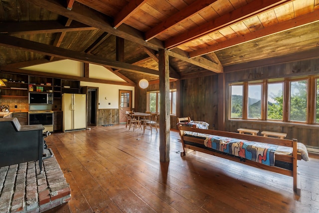 interior space with vaulted ceiling with beams, hardwood / wood-style flooring, wooden ceiling, and white refrigerator