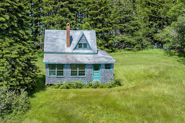 view of side of home featuring a yard