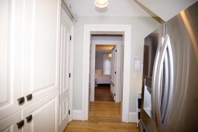 corridor with light wood-type flooring