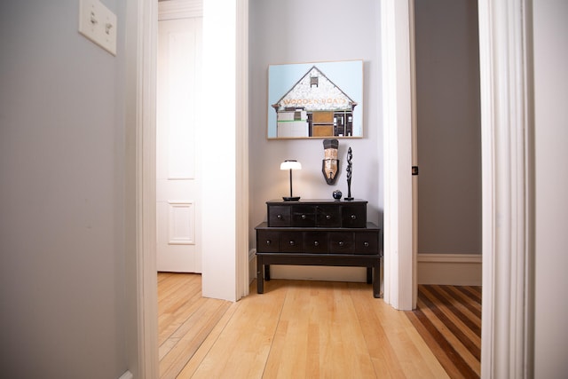 hall with wood-type flooring