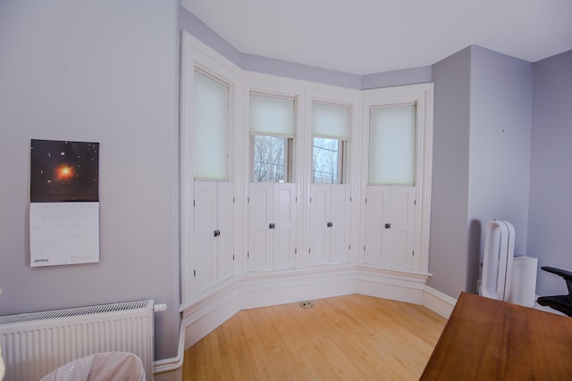 interior space featuring hardwood / wood-style floors and radiator