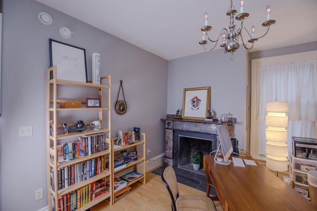 office area featuring light hardwood / wood-style flooring and a notable chandelier