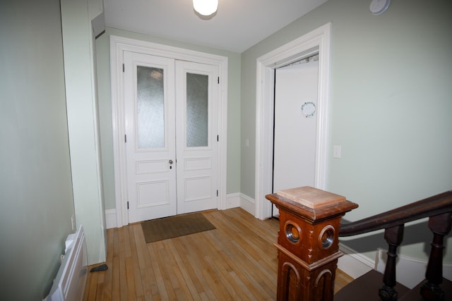 foyer entrance with light hardwood / wood-style floors