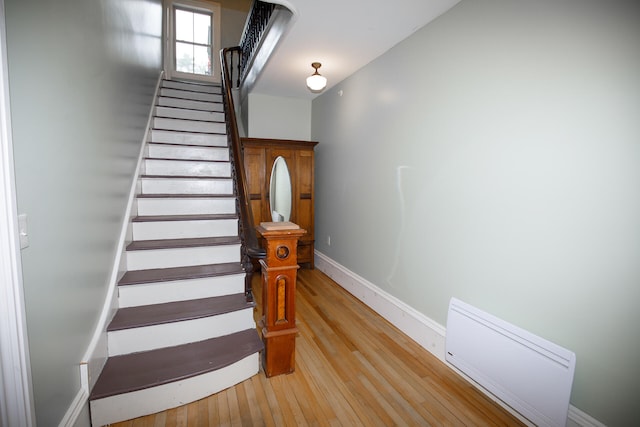 stairs featuring wood-type flooring