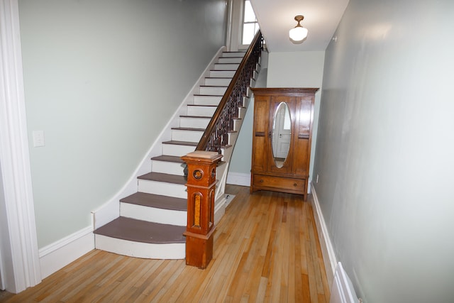 staircase featuring hardwood / wood-style flooring