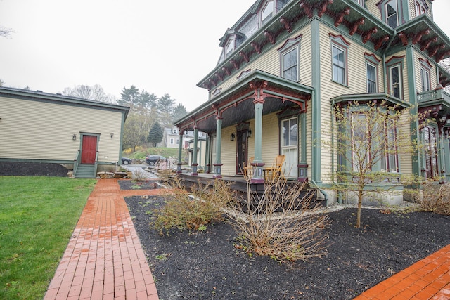 view of side of property featuring a porch