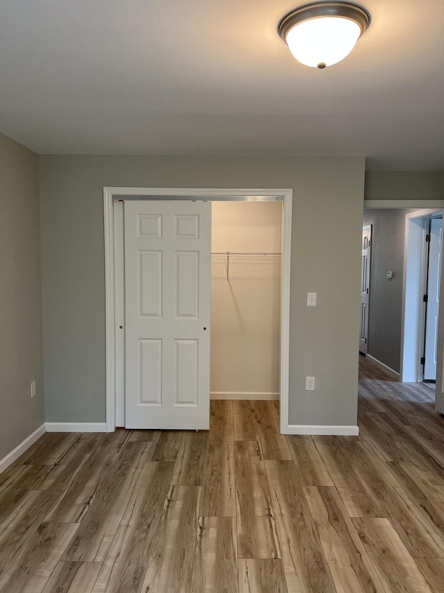 10 Mathew Way, Scarborough, ME 04074 - unfurnished bedroom with a closet, wood finished floors, and a spacious closet