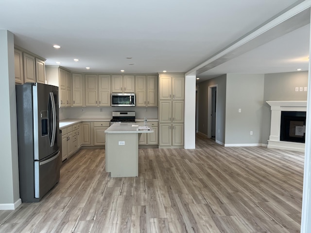 10 Mathew Way, Scarborough, ME 04074 - kitchen featuring stainless steel appliances, light countertops, a center island, recessed lighting, and open floor plan