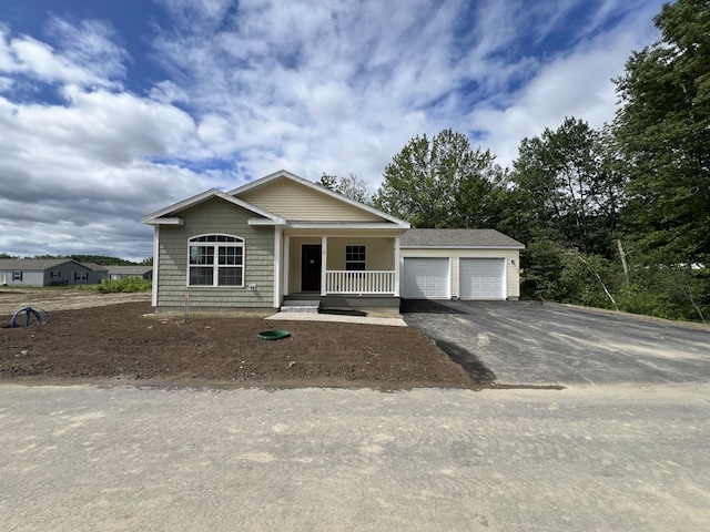 10 Mathew Way, Scarborough, ME 04074 - view of front of house with a porch, a garage, and asphalt driveway
