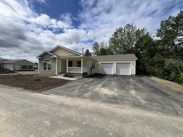 10 Mathew Way, Scarborough, ME 04074 - single story home with driveway, a porch, and an attached garage