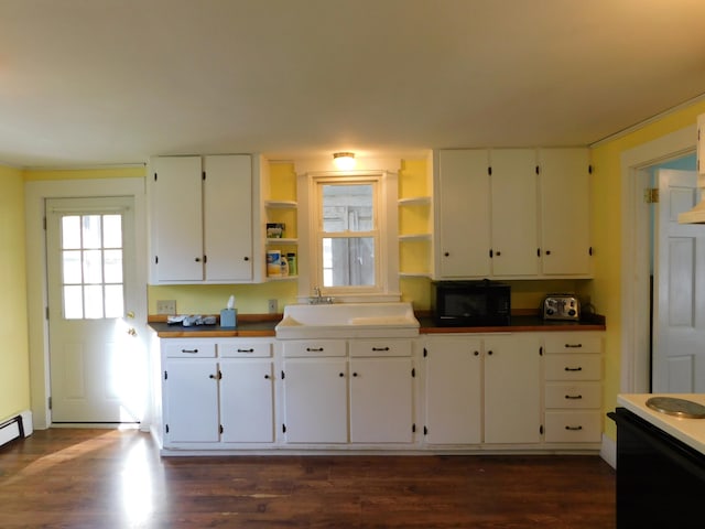 kitchen featuring black appliances, white cabinetry, sink, and dark hardwood / wood-style floors