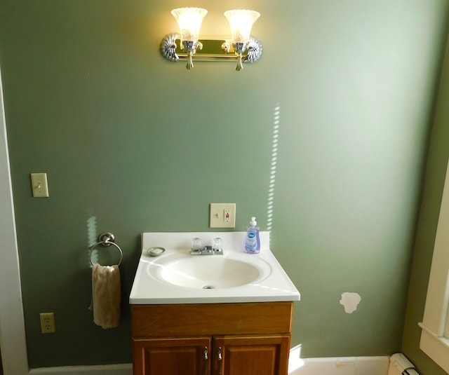 bathroom with vanity and a notable chandelier