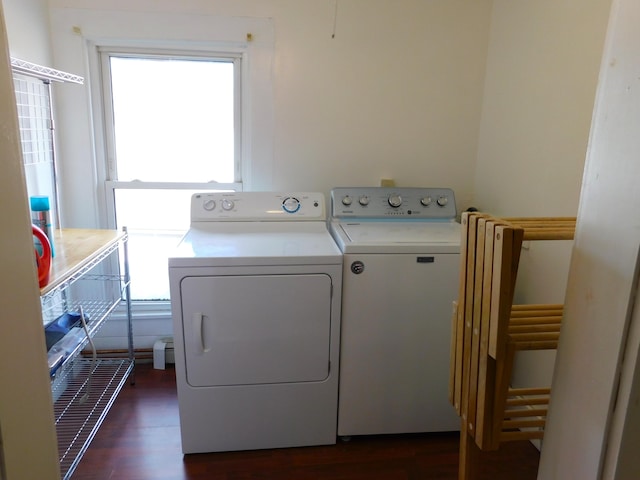 washroom featuring washer and dryer and dark hardwood / wood-style floors