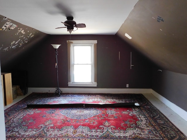 additional living space with ceiling fan and vaulted ceiling