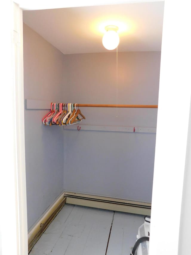 spacious closet featuring baseboard heating