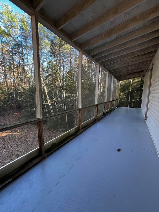 unfurnished sunroom featuring a healthy amount of sunlight