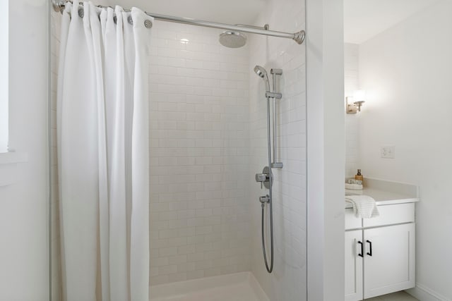 bathroom with a shower with curtain and vanity