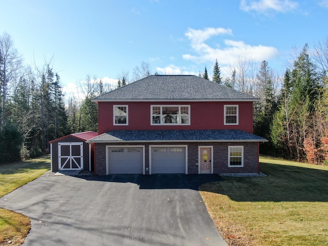 front facade with a garage, a front yard, and a shed