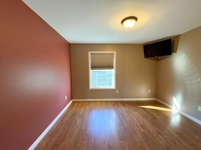 unfurnished room featuring wood-type flooring