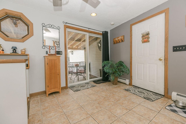 doorway to outside with baseboard heating, light tile patterned floors, and ceiling fan