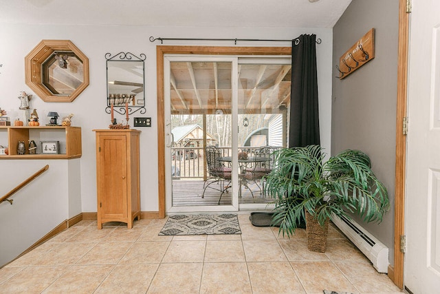 entryway featuring light tile patterned floors and a baseboard radiator