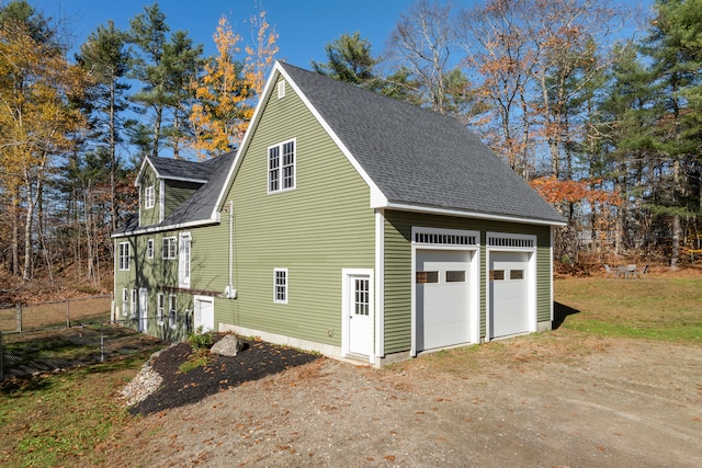 view of side of home with a garage