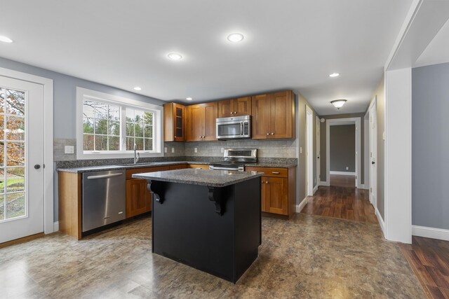 610 W Neck Rd, Nobleboro, ME 04555 - kitchen with stainless steel appliances, brown cabinetry, decorative backsplash, and recessed lighting
