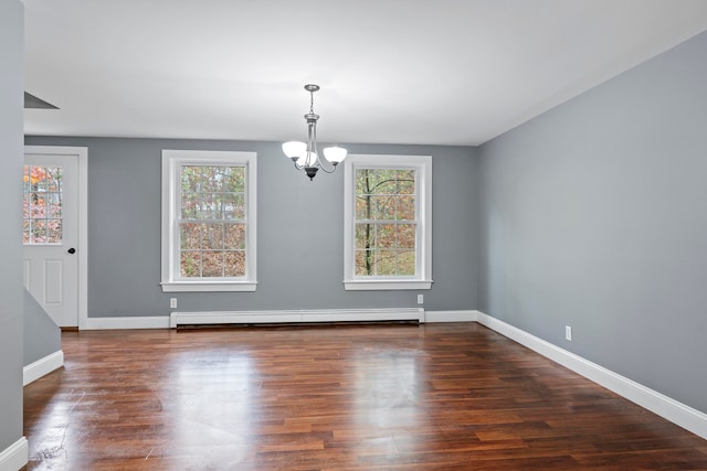 unfurnished dining area with a baseboard radiator, dark hardwood / wood-style flooring, and a healthy amount of sunlight