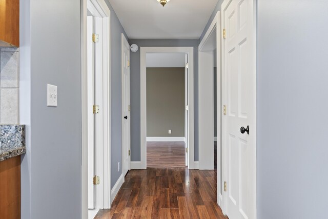 610 W Neck Rd, Nobleboro, ME 04555 - corridor featuring dark wood-style floors and baseboards
