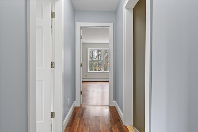 610 W Neck Rd, Nobleboro, ME 04555 - hallway featuring dark wood-style flooring and a baseboard radiator