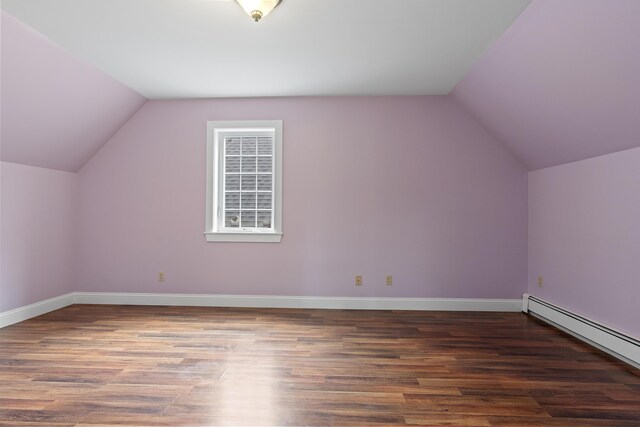 610 W Neck Rd, Nobleboro, ME 04555 - bonus room featuring a baseboard heating unit, vaulted ceiling, and wood finished floors