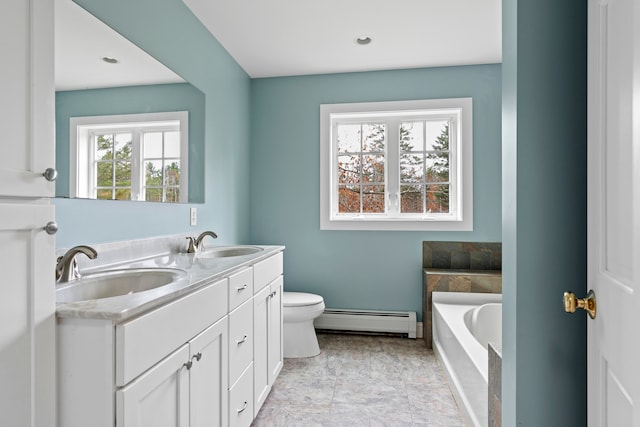 bathroom with baseboard heating, a bathtub, vanity, and toilet