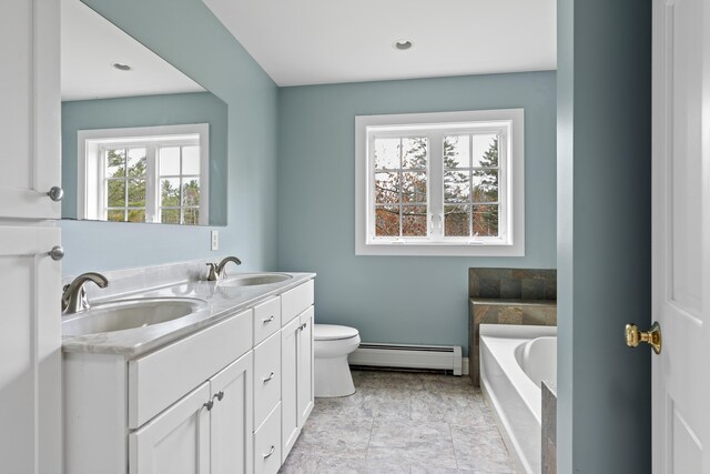 610 W Neck Rd, Nobleboro, ME 04555 - full bathroom with a baseboard radiator, a bath, and double vanity