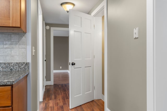 hallway featuring dark hardwood / wood-style flooring