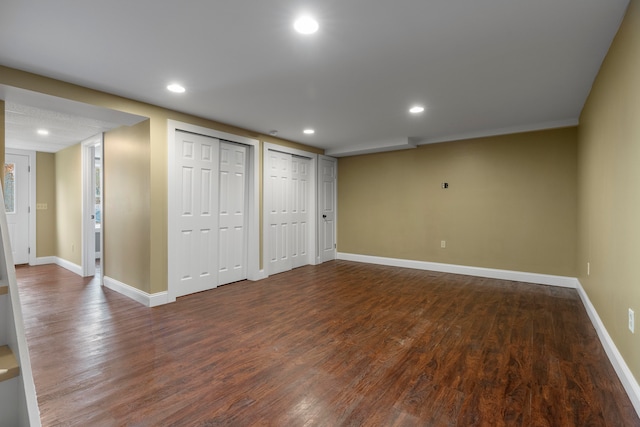 basement featuring dark hardwood / wood-style flooring