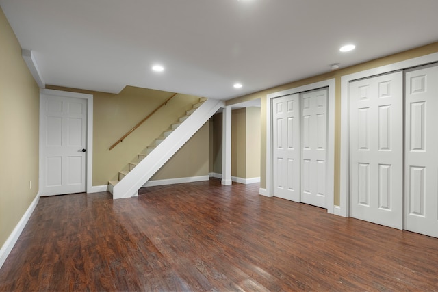 basement featuring dark hardwood / wood-style flooring