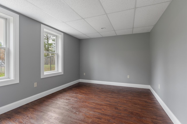 610 W Neck Rd, Nobleboro, ME 04555 - unfurnished room with dark wood-type flooring and a paneled ceiling
