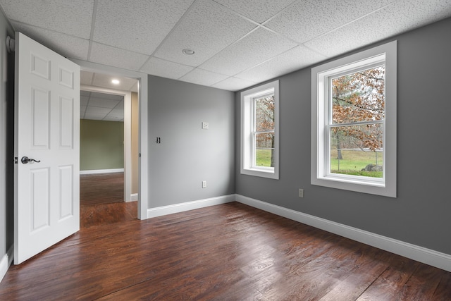 610 W Neck Rd, Nobleboro, ME 04555 - unfurnished room featuring a drop ceiling and dark wood-style floors