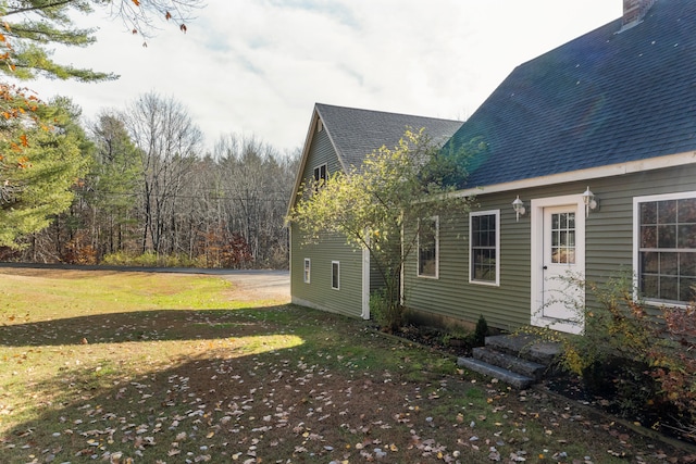 view of property exterior featuring a yard