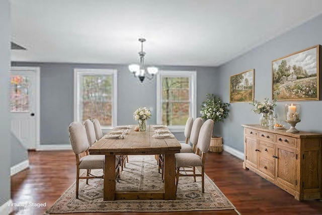 610 W Neck Rd, Nobleboro, ME 04555 - dining space with a chandelier and dark wood-type flooring