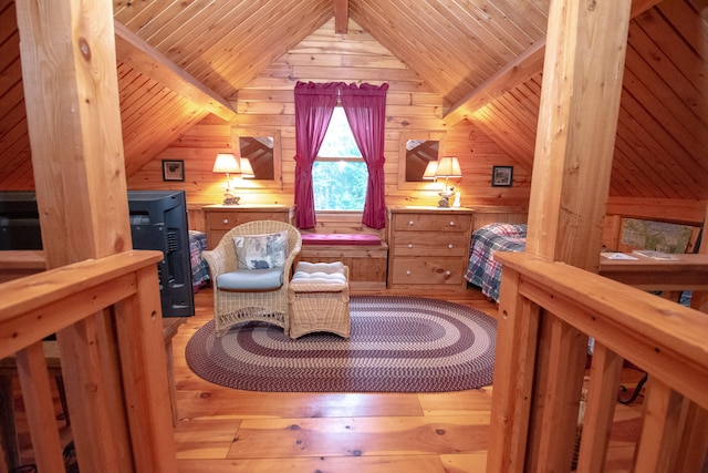 bedroom with lofted ceiling, wooden walls, hardwood / wood-style flooring, and wooden ceiling