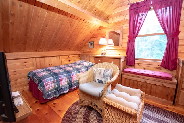 bedroom with wood ceiling, vaulted ceiling with beams, hardwood / wood-style flooring, and wood walls