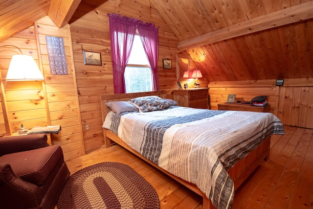 bedroom featuring hardwood / wood-style flooring, wood walls, wood ceiling, and vaulted ceiling with beams