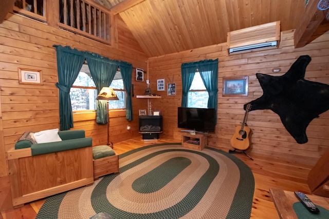 865 Barnard Rd, Williamsburg Twp, ME 04414 - living room with wood ceiling, light wood-style floors, vaulted ceiling, wood walls, and a wood stove