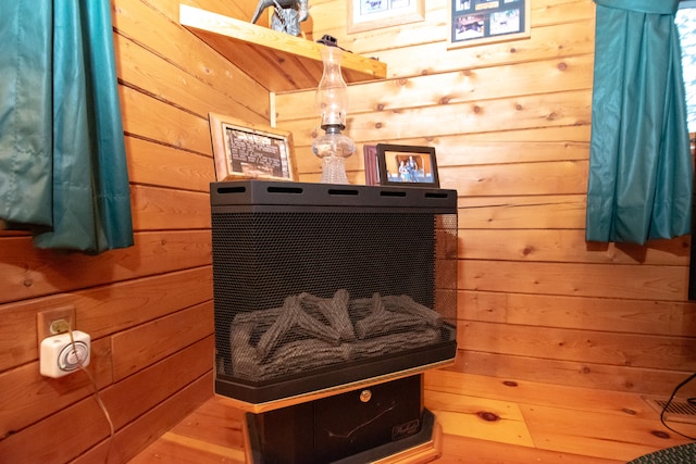 view of sauna / steam room with wooden walls and wood-type flooring