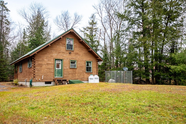 865 Barnard Rd, Williamsburg Twp, ME 04414 - back of house with log exterior, entry steps, and a lawn