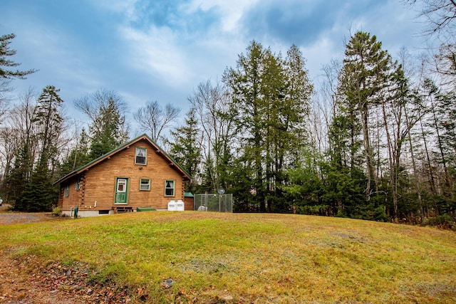 865 Barnard Rd, Williamsburg Twp, ME 04414 - view of property exterior with a yard and entry steps